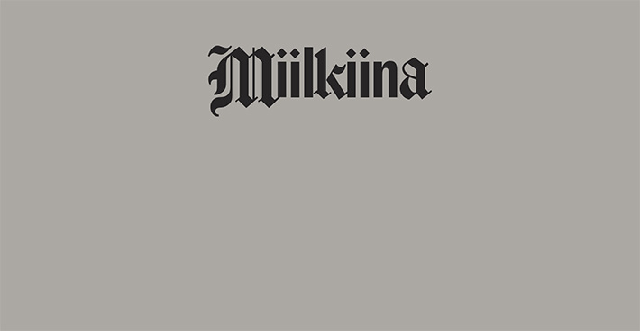 Miilkiina in blackletter style, black against dark gray