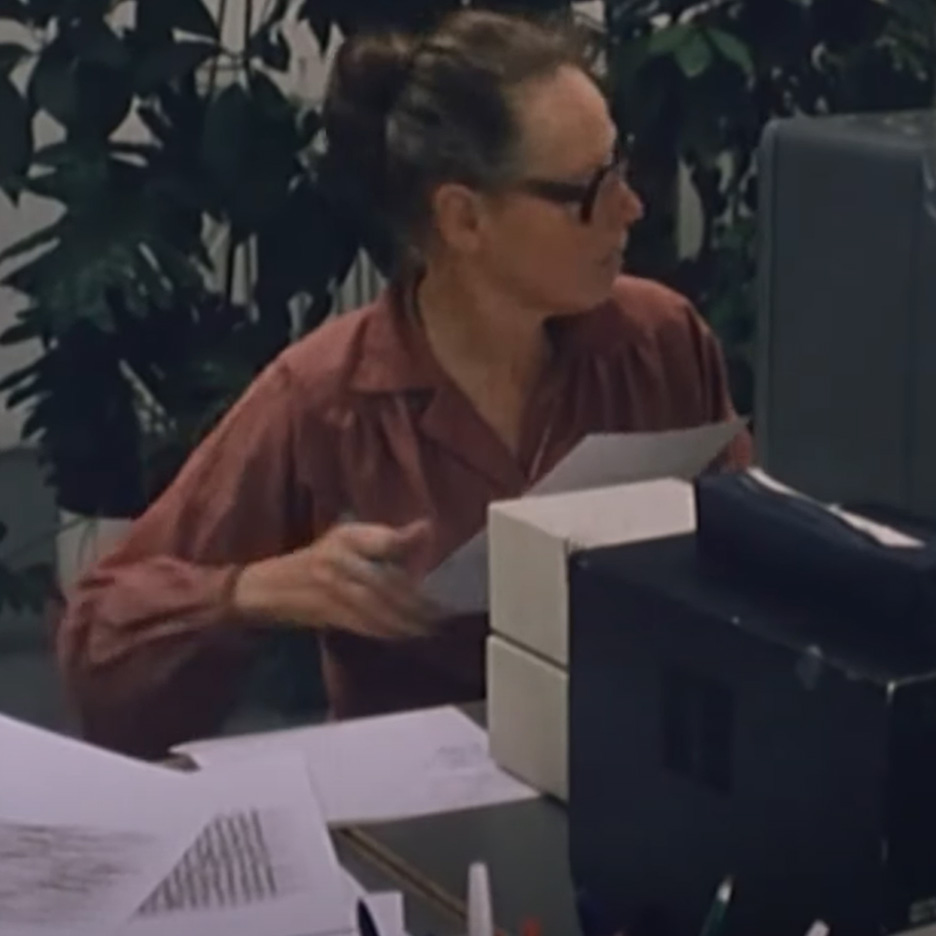 Artist Vera Molnar sat behind a computer, believe its around 1980 but hard to date, if you watch the video it shows a small Houston Instruments Hi Plot Flat-Bed plotter working away next to her.
